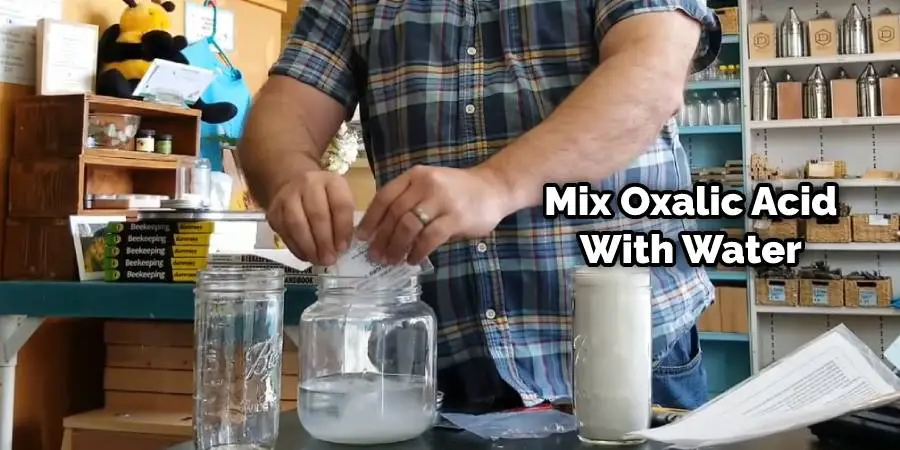 Mix oxalic acid with water
