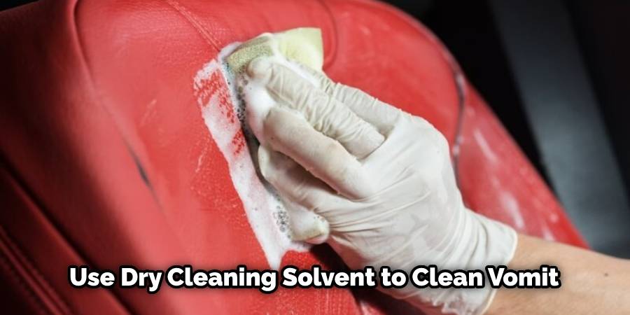 Use dry cleaning solvent to clean vomit