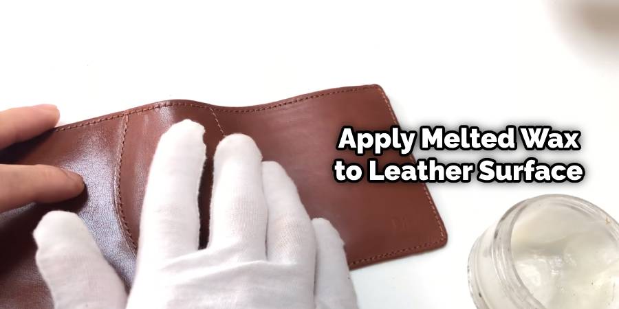 Apply melted wax to leather surface