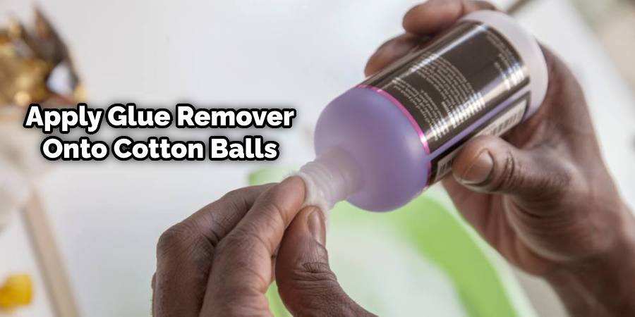 Apply some glue remover onto cotton balls