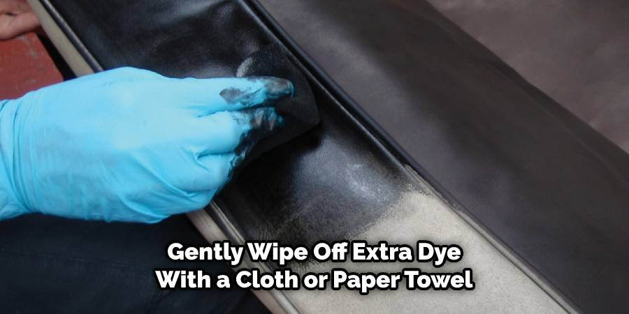 Wipe off extra dye with a cloth or paper towel