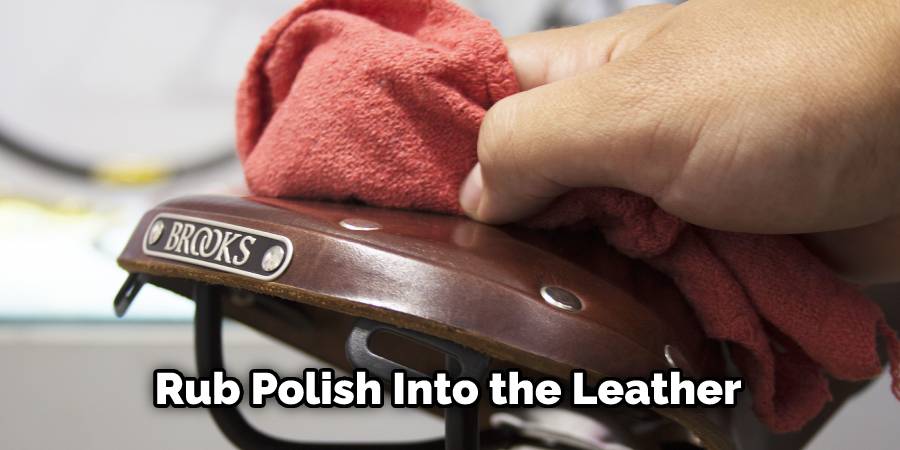 Rub polish into the leather