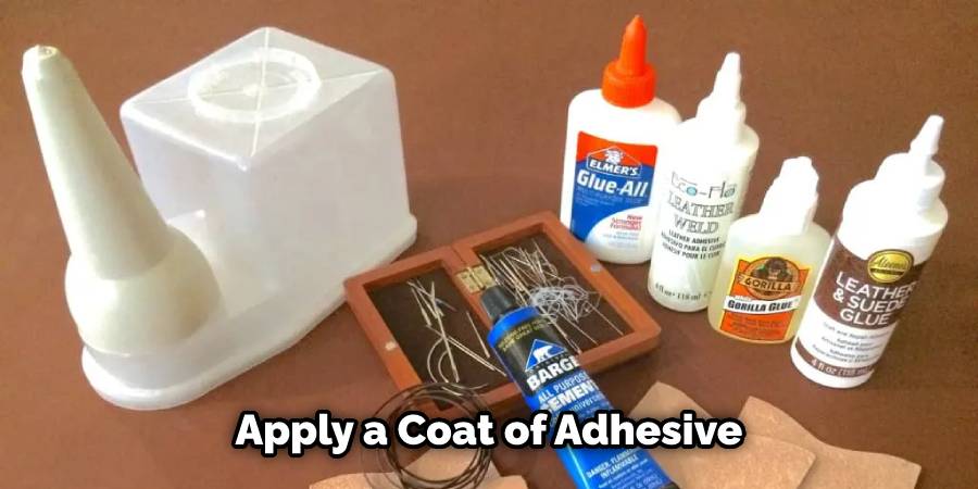 Applying a coat of adhesive