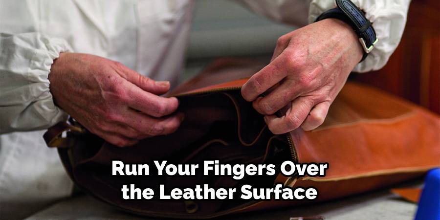 Run your fingers over the surface of the leather