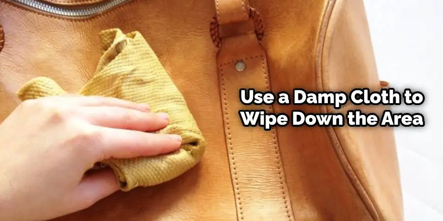 Use a damp cloth to wipe down the area