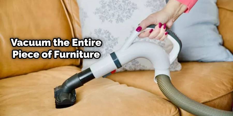 Vacuum the entire piece of furniture