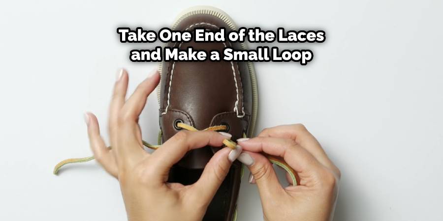 Take one end of the laces and make a small loop