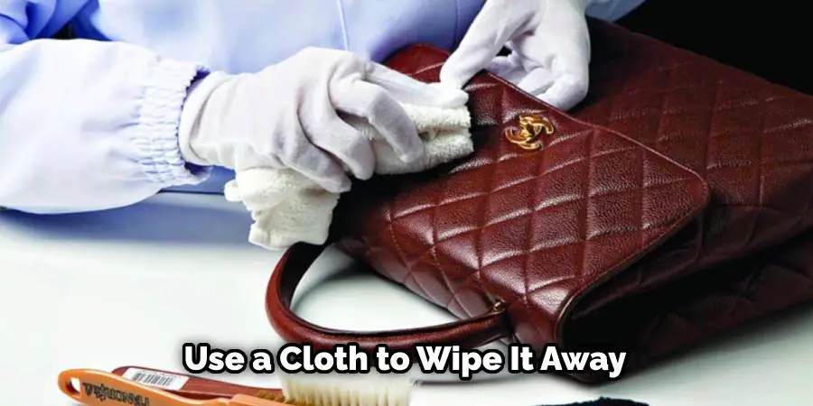 Use a cloth to wipe it away