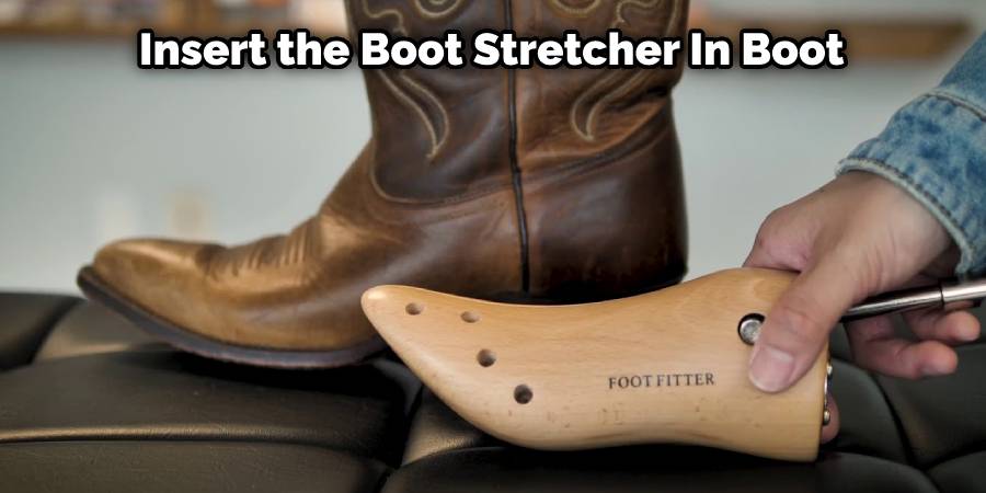 Insert the boot stretcher in boot
