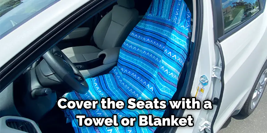Cover the Seats with a Towel or Blanket