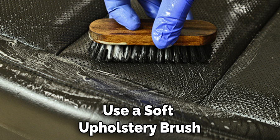 Use a Soft Upholstery Brush
