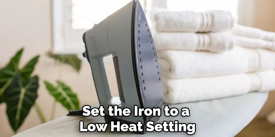 Set the Iron to a Low Heat Setting