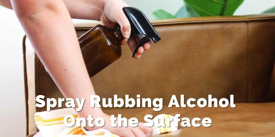 Spray Rubbing Alcohol Onto the Surface