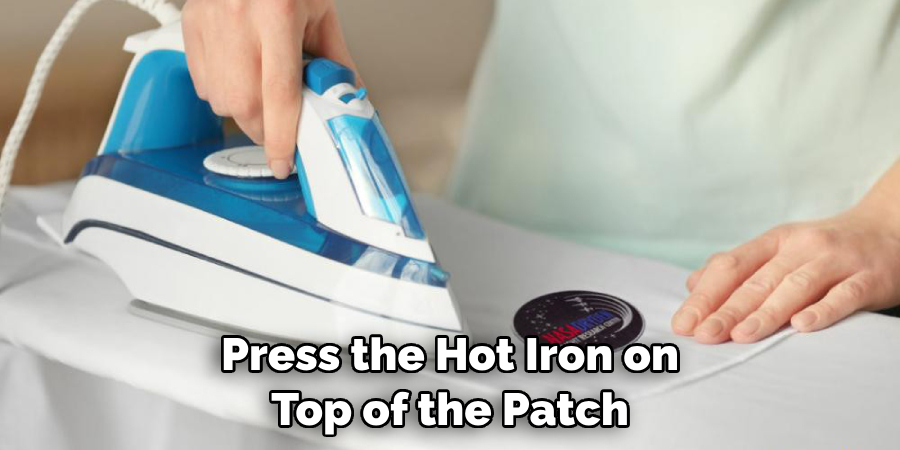 Press the Hot Iron on Top of the Patch