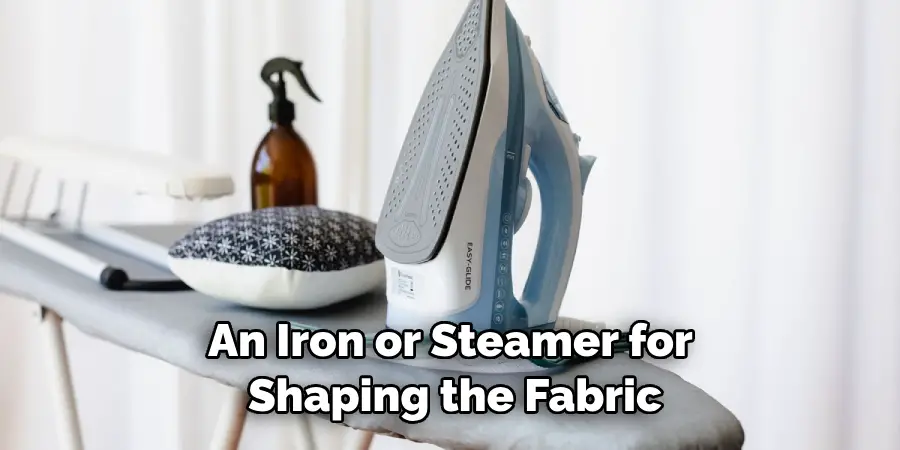 An Iron or Steamer for Shaping the Fabric