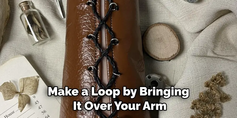 Make a Loop by Bringing It Over Your Arm