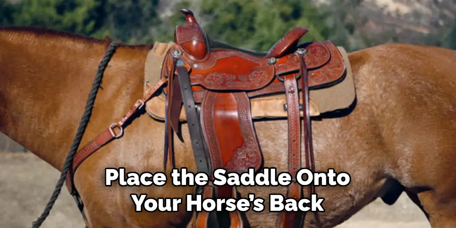 Place the Saddle Onto Your Horse’s Back