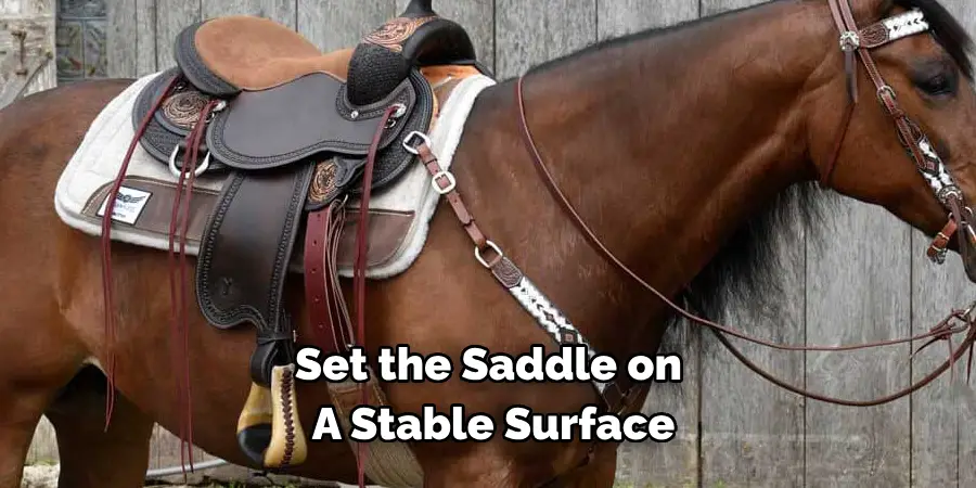 Set the saddle on a stable surface