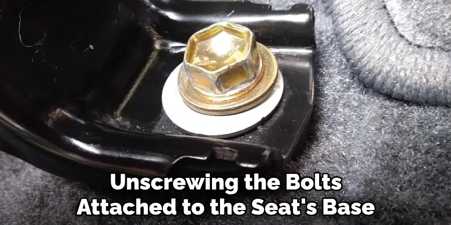 Unscrewing the Bolts Attached to the Seat's Base
