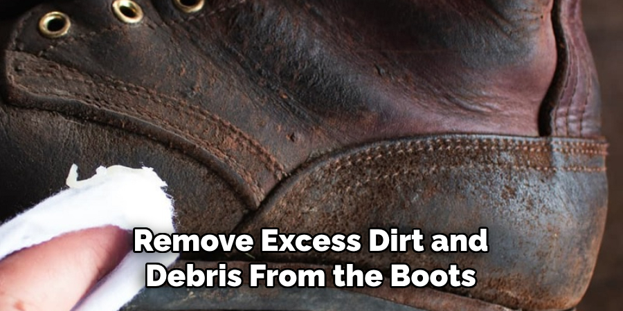 Remove Excess Dirt and Debris From the Boots