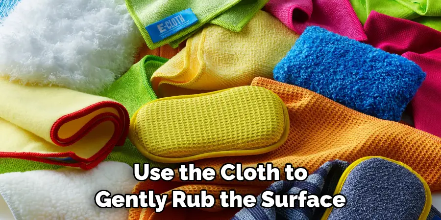 Use the Cloth to Gently Rub the Surface