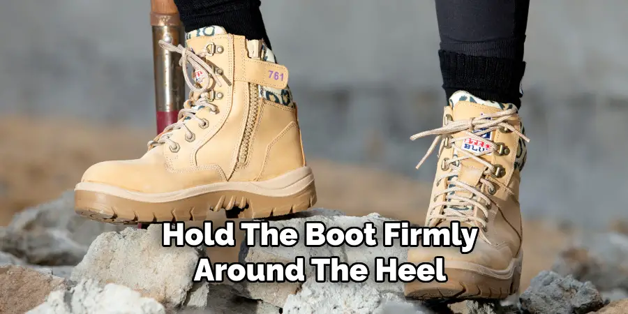 Hold the Boot Firmly Around the Heel 