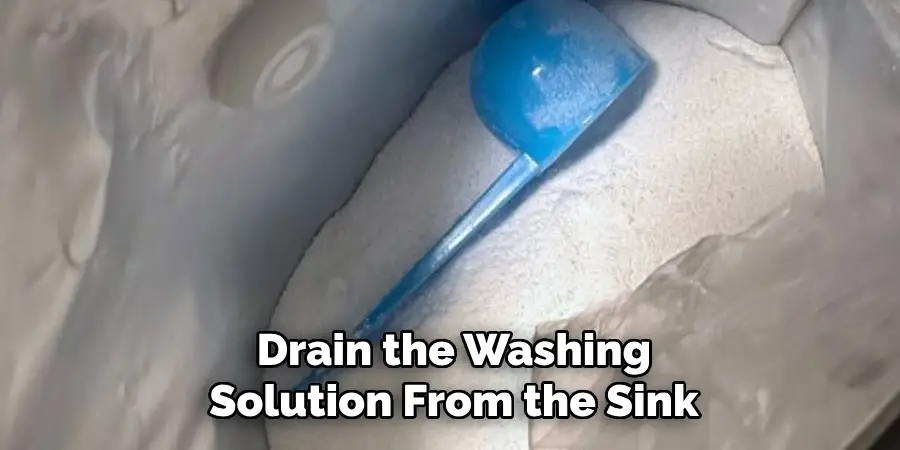 Drain the Washing Solution From the Sink