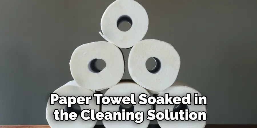 Paper Towel Soaked in the Cleaning Solution