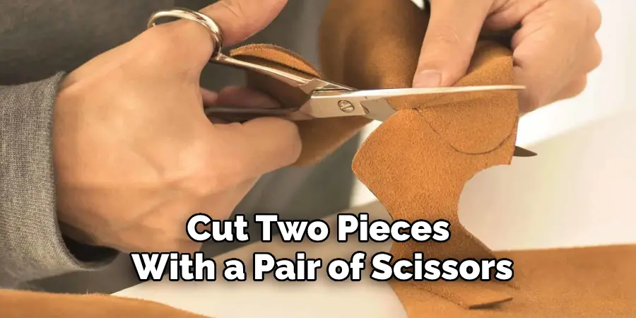 Cut Two Pieces of Leather With a Pair of Scissors