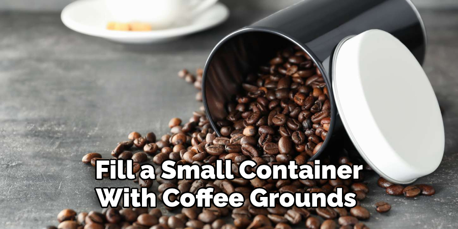 Fill a Small Container With Coffee Grounds 