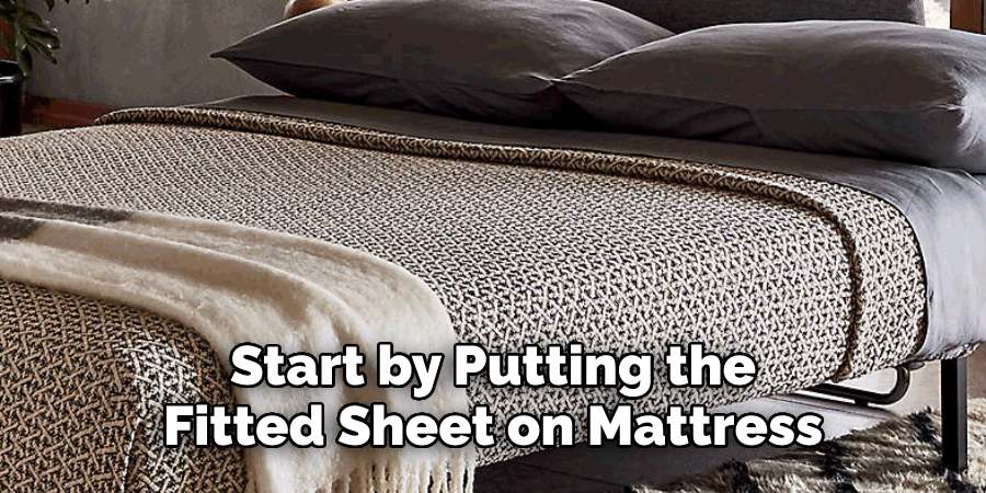 Start by Putting the
Fitted Sheet on Mattress