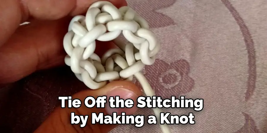 Tie Off the Stitching by Making a Knot
